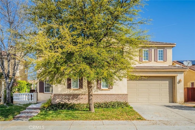 36368 Par Ln, Beaumont, CA 92223 - view of front facade with driveway, an attached garage, and stucco siding