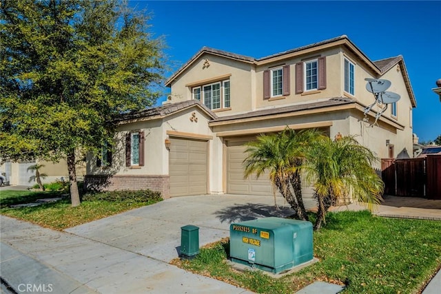 36368 Par Ln, Beaumont, CA 92223 - view of front facade featuring an attached garage, driveway, stucco siding, and brick siding