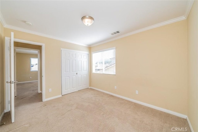 36368 Par Ln, Beaumont, CA 92223 - unfurnished bedroom featuring light carpet, multiple windows, crown molding, baseboards, and a closet