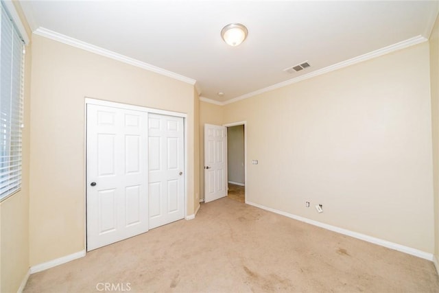 36368 Par Ln, Beaumont, CA 92223 - unfurnished bedroom with ornamental molding, light carpet, baseboards, and a closet