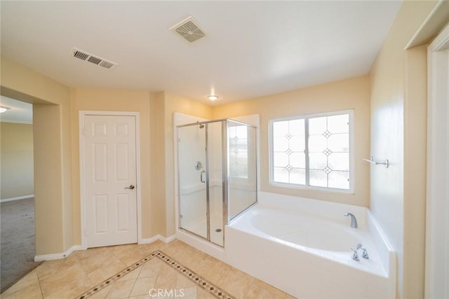 36368 Par Ln, Beaumont, CA 92223 - full bathroom with tile patterned floors, a shower stall, a garden tub, and baseboards