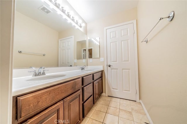36368 Par Ln, Beaumont, CA 92223 - bathroom with tile patterned flooring, double vanity, and baseboards