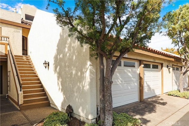 27869 Mazagon Unit 111, Mission Viejo, CA 92692 - view of side of property featuring stucco siding and stairs