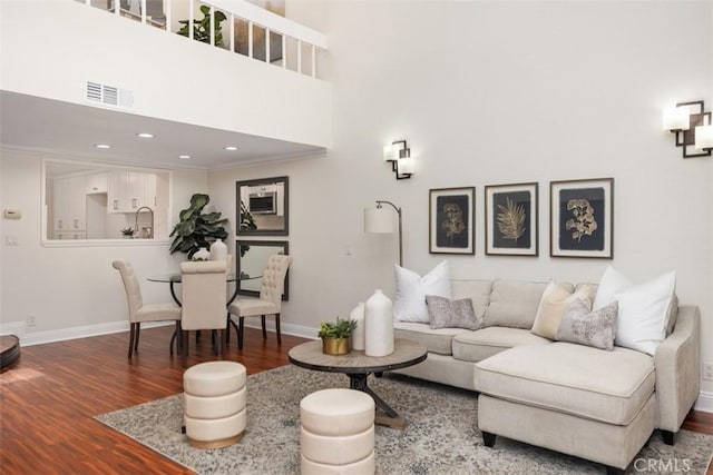 27869 Mazagon Unit 111, Mission Viejo, CA 92692 - living room with wood finished floors, baseboards, a high ceiling, and recessed lighting