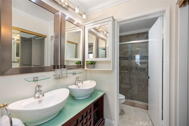 27869 Mazagon Unit 111, Mission Viejo, CA 92692 - full bathroom featuring a shower stall, toilet, crown molding, and double vanity