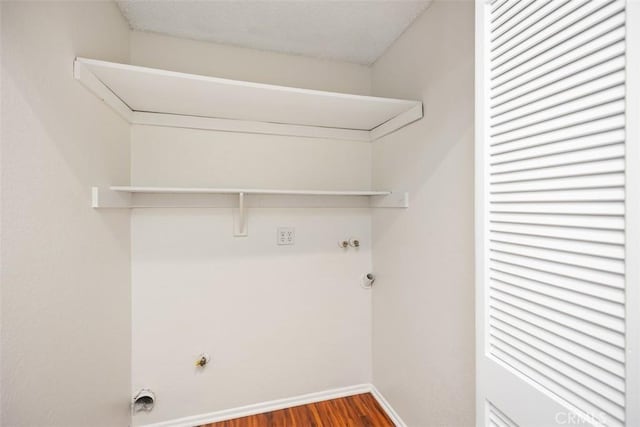 27869 Mazagon Unit 111, Mission Viejo, CA 92692 - washroom featuring gas dryer hookup, wood finished floors, and baseboards