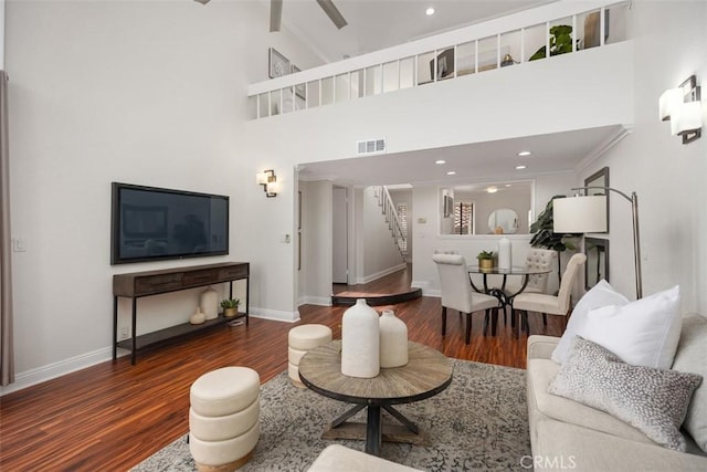 27869 Mazagon Unit 111, Mission Viejo, CA 92692 - living area featuring stairway, wood finished floors, baseboards, recessed lighting, and a towering ceiling