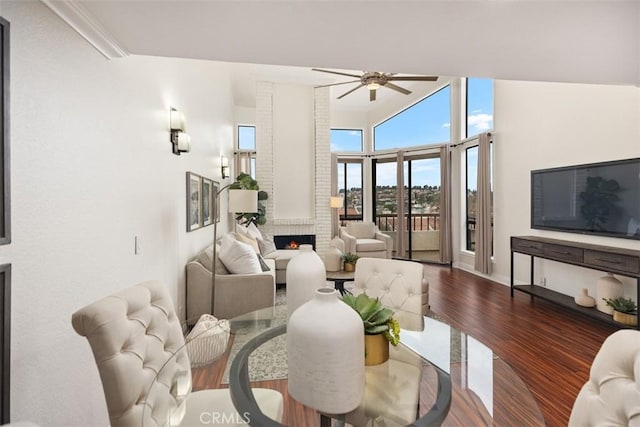 27869 Mazagon Unit 111, Mission Viejo, CA 92692 - living room featuring a ceiling fan, a fireplace, dark wood-type flooring, and baseboards