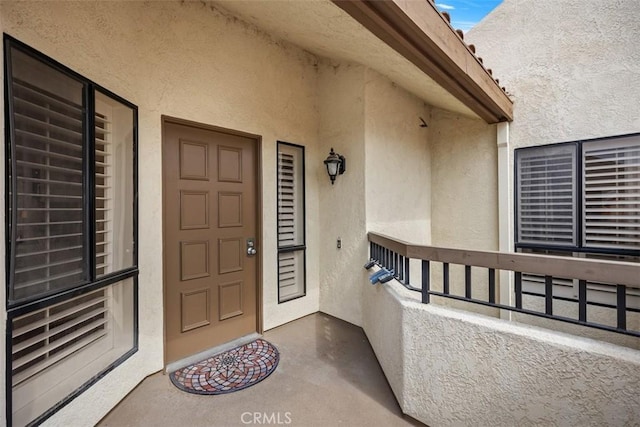 27869 Mazagon Unit 111, Mission Viejo, CA 92692 - entrance to property with stucco siding and a balcony