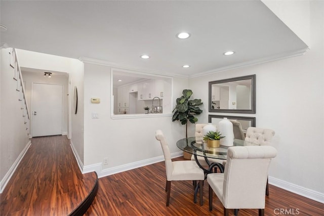 27869 Mazagon Unit 111, Mission Viejo, CA 92692 - dining area featuring baseboards, wood finished floors, recessed lighting, and crown molding