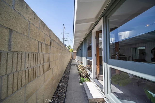 view of side of property with fence