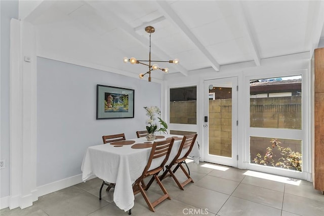 dining space featuring light tile patterned flooring, a chandelier, vaulted ceiling with beams, and baseboards