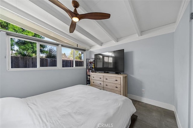 bedroom featuring lofted ceiling with beams, a ceiling fan, concrete flooring, and baseboards