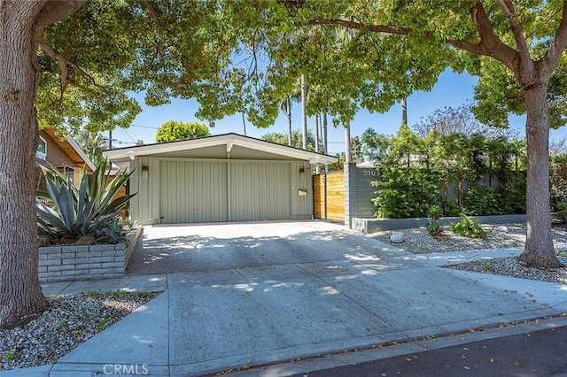 garage with concrete driveway