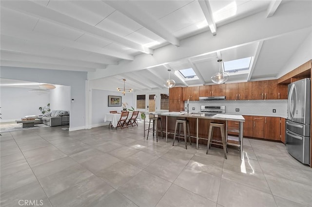 kitchen featuring lofted ceiling with beams, light countertops, freestanding refrigerator, stove, and brown cabinetry
