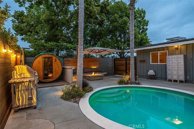 3109 Pattiz Ave, Long Beach, CA 90808 - view of swimming pool with a fire pit, mail area, and fence