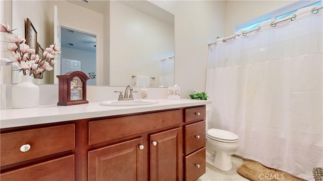 full bath with toilet and vanity