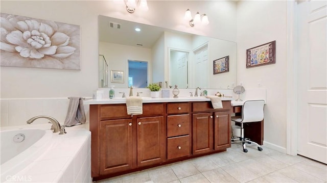 bathroom featuring a bath, visible vents, double vanity, a sink, and tile patterned flooring