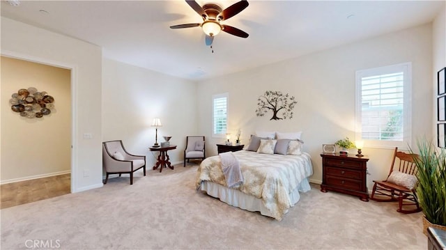 bedroom featuring baseboards, ceiling fan, and carpet flooring