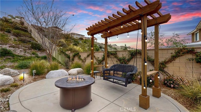 view of patio / terrace featuring an outdoor fire pit, a fenced backyard, and a pergola