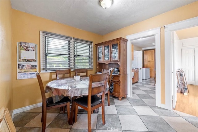 27 E Platt St, Long Beach, CA 90805 - dining space with baseboards and light tile patterned flooring