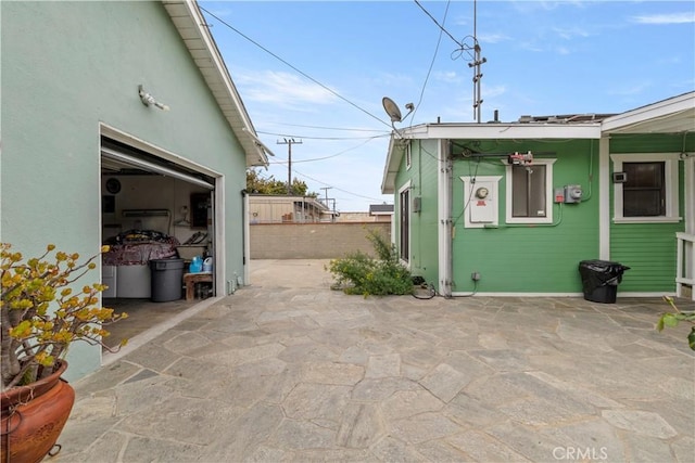 27 E Platt St, Long Beach, CA 90805 - view of patio / terrace featuring fence and a garage