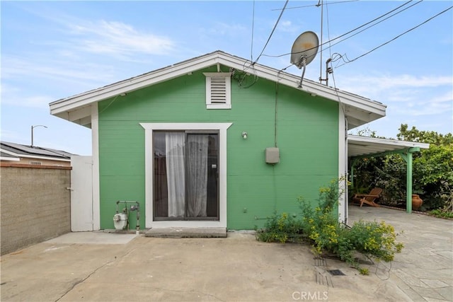 27 E Platt St, Long Beach, CA 90805 - back of house with a patio and concrete block siding