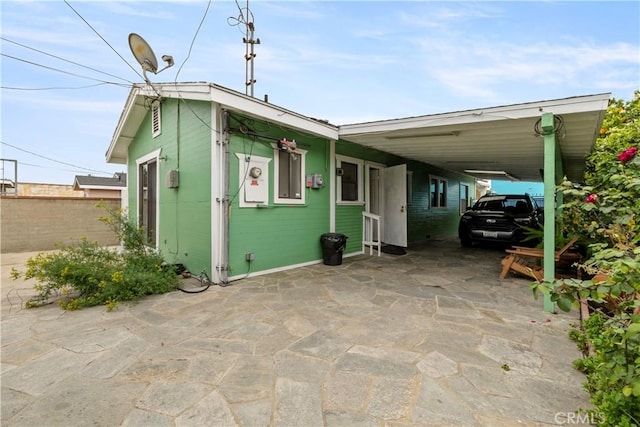 27 E Platt St, Long Beach, CA 90805 - view of front of house with an attached carport, fence, and driveway