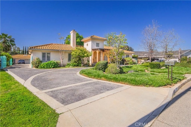2720 E Sunset Hill Dr, West Covina, CA 91791 - mediterranean / spanish home with a chimney, a tile roof, and stucco siding