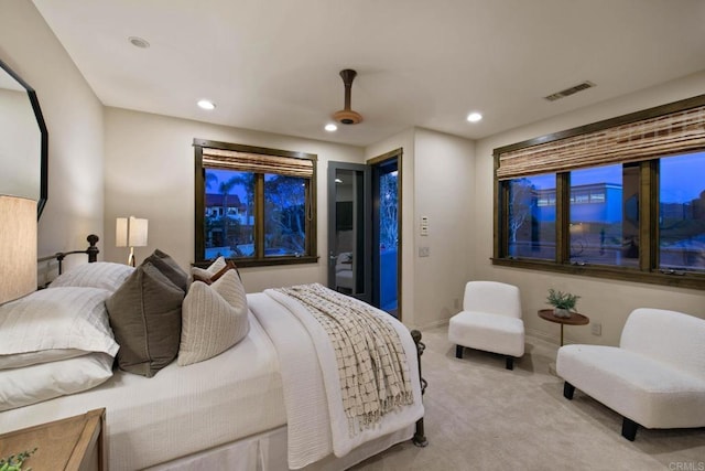 carpeted bedroom with baseboards, access to outside, recessed lighting, and visible vents