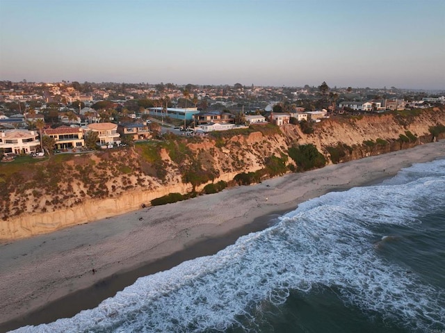 bird's eye view featuring a water view, a residential view, and a view of the beach