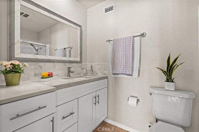 6279 Lincoln Ave, Buena Park, CA 90620 - full bath with vanity, decorative backsplash, tile patterned flooring, and an enclosed shower