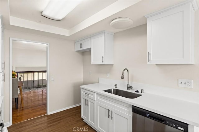 6279 Lincoln Ave, Buena Park, CA 90620 - kitchen with dishwasher, white cabinets, light countertops, dark wood finished floors, and a tray ceiling