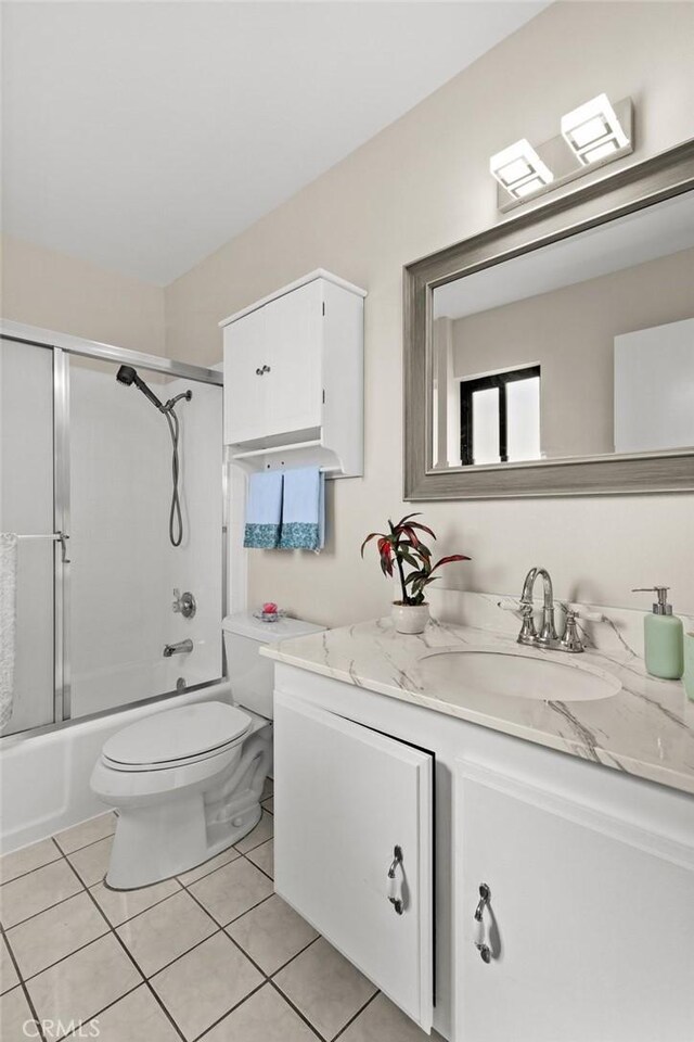 6279 Lincoln Ave, Buena Park, CA 90620 - bathroom with vanity, bath / shower combo with glass door, and tile patterned floors