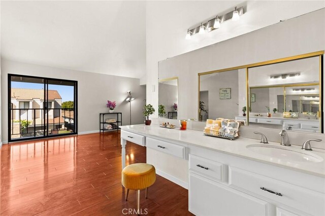 6279 Lincoln Ave, Buena Park, CA 90620 - bathroom featuring vanity, wood finished floors, and a towering ceiling