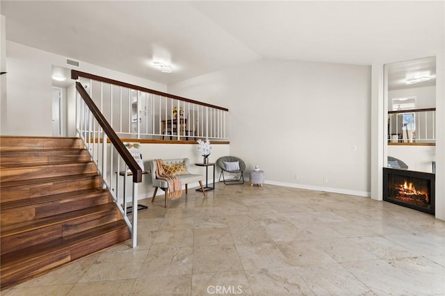6279 Lincoln Ave, Buena Park, CA 90620 - unfurnished room with stairway, a lit fireplace, and vaulted ceiling