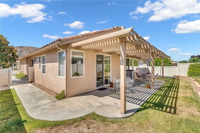 5775 Myrtle Beach Dr, Banning, CA 92220 - rear view of house with a pergola, stucco siding, a patio area, central air condition unit, and a tiled roof