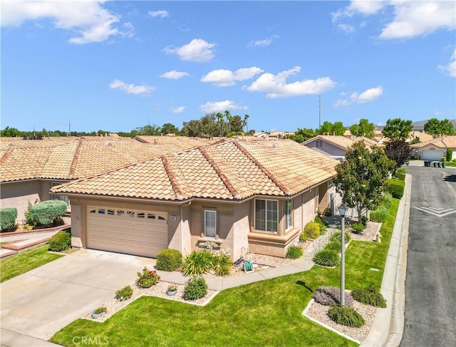 5775 Myrtle Beach Dr, Banning, CA 92220 - mediterranean / spanish-style house with stucco siding, a garage, concrete driveway, a tile roof, and a front lawn