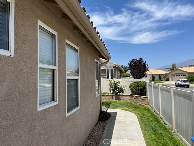 5775 Myrtle Beach Dr, Banning, CA 92220 - view of side of home featuring stucco siding and a mountain view