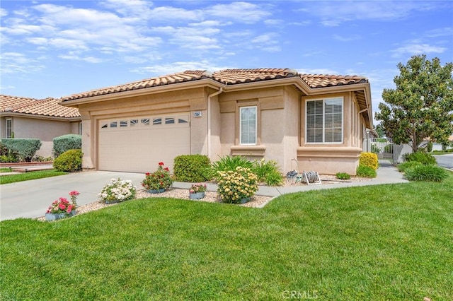 5775 Myrtle Beach Dr, Banning, CA 92220 - mediterranean / spanish house featuring a tiled roof, driveway, an attached garage, a front yard, and stucco siding