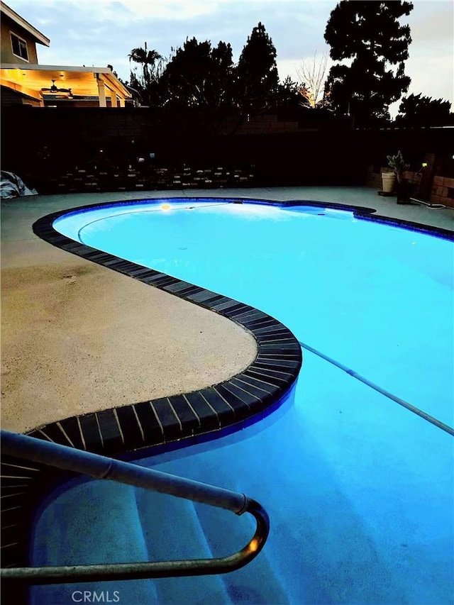 view of swimming pool with a fenced in pool, a patio, and a fenced backyard