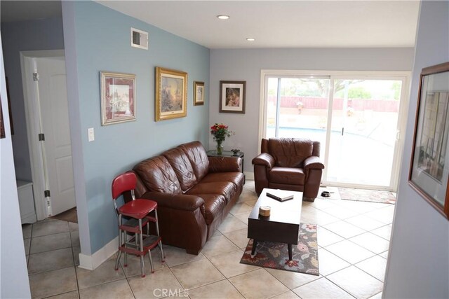 living area featuring recessed lighting, visible vents, and light tile patterned floors