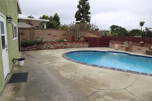 view of pool with a fenced in pool, a patio, and a fenced backyard