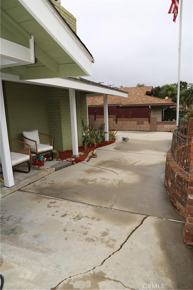 view of patio featuring fence