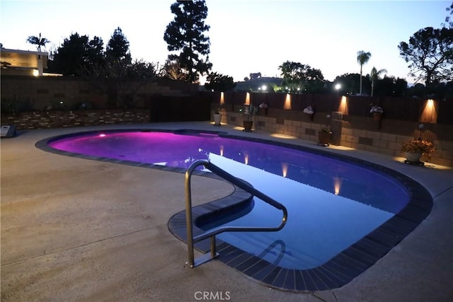 view of swimming pool with a fenced in pool, a patio, and a fenced backyard