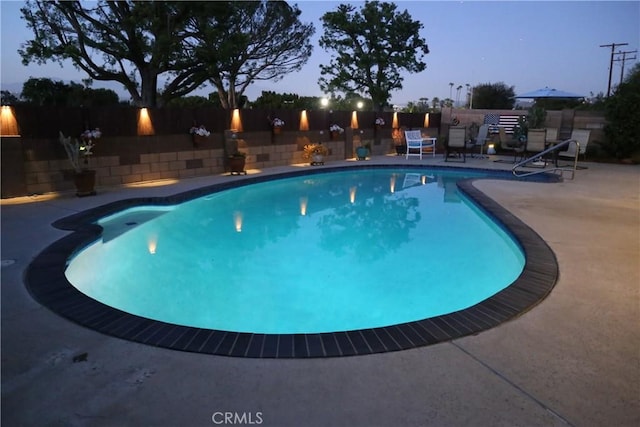 view of pool featuring a fenced backyard, a patio area, and a fenced in pool