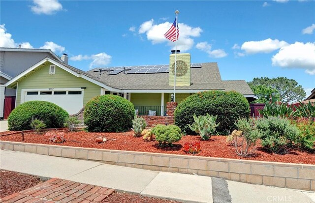 18137 Galatina St, Rowland Heights, CA 91748 - view of front of home featuring solar panels, covered porch, a garage, a chimney, and roof with shingles