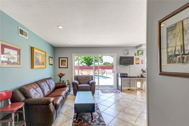 18137 Galatina St, Rowland Heights, CA 91748 - living area featuring light tile patterned floors, recessed lighting, and a textured ceiling