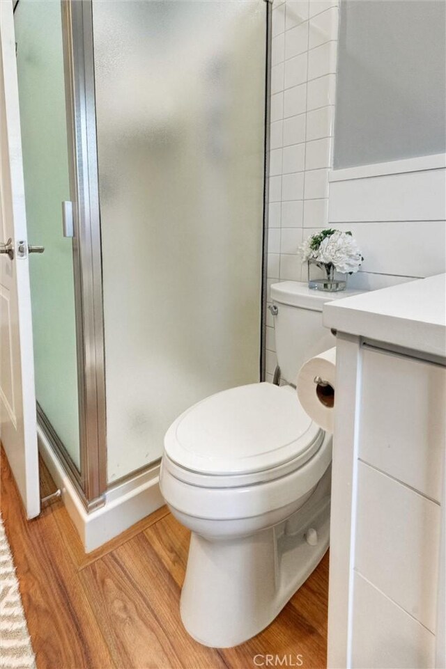 18137 Galatina St, Rowland Heights, CA 91748 - bathroom with a shower stall, wood finished floors, and vanity