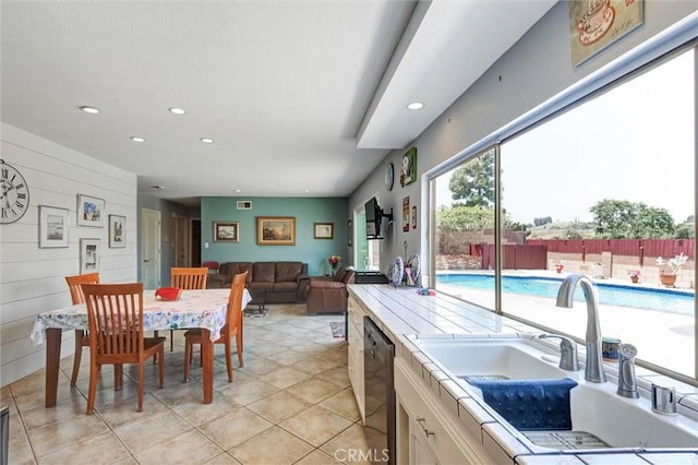 18137 Galatina St, Rowland Heights, CA 91748 - kitchen with dishwasher, recessed lighting, white cabinetry, light tile patterned flooring, and open floor plan